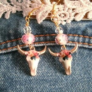 Enamel steer bull skull lamp work earrings with crystal and lamp work rose with gold fleck sparkle in lamp work glass bead