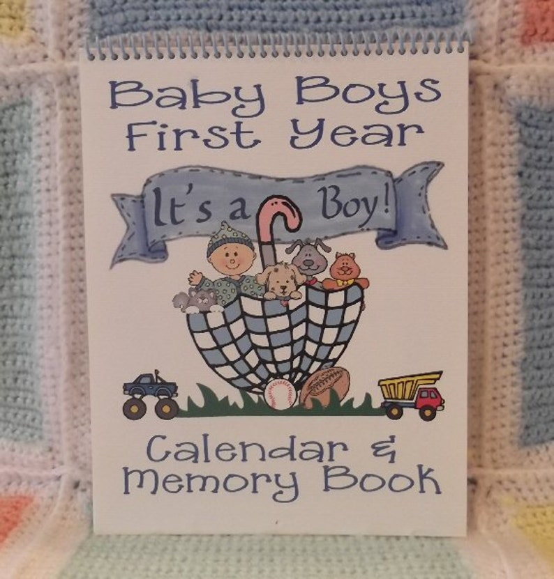 First Year baby calendar and memory book for baby boy. This calendar is 13 months to include 1st and 2nd birthdays. There are several photo and journal pages and includes a milestone and holidays sticker sheet.