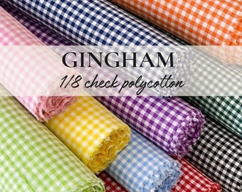 May include: Rolled fabric bolts in various colors, including orange, navy, pink, green, yellow, purple, light blue, red, and black. The fabric is gingham, 1/8 check polycotton, with the text "GINGHAM 1/8 check polycotton" visible.