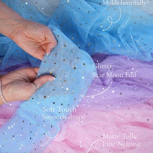 May include: A close-up of layered tulle fabric in shades of blue, purple, pink, and fuchsia. The fabric has a soft touch and smooth drape, with glitter star and moon foil accents. The text "lalathread" is visible.