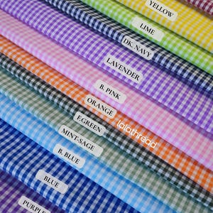 May include: A vibrant display of gingham fabric swatches in various colors, including red, yellow, lime, and purple. Each swatch is labeled with its color name, and the brand name "lalathread" is visible.