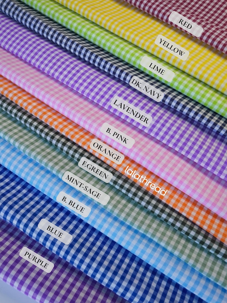 May include: A vibrant display of gingham fabric swatches in various colors, including red, yellow, lime, and purple. Each swatch is labeled with its color name, and the brand name "lalathread" is visible.