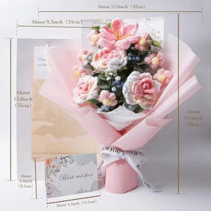 May include: A handcrafted bouquet of crochet flowers, including pink roses and lilies, wrapped in pink paper. The bouquet is tied with a white ribbon that says "FOR YOU". A card with the words "Best wishes" is included. The bouquet is about 15.8 inches (40cm) tall.