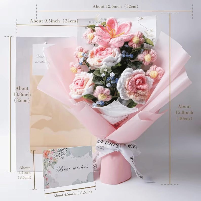 May include: A handcrafted bouquet of crochet flowers, including pink roses and lilies, wrapped in pink paper. The bouquet is tied with a white ribbon that says "FOR YOU". A card with the words "Best wishes" is included. The bouquet is about 15.8 inches (40cm) tall.