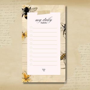 Puede incluir: Un bloc de notas con el texto "my daily habits" en escritura elegante, pegado a un fondo de estilo vintage. El bloc de notas presenta una lista de círculos en blanco para marcar, un símbolo de corazón e ilustraciones de abejas y flores.