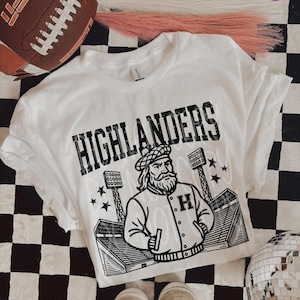 Highlanders Football T-Shirt in Youth Size – Retro School Mascot Tee – Bold Game Day Spirit Shirt – Unisex Fan Apparel for Teens & Adults