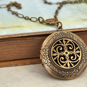 THE ETERNAL KNOT Celtic knot locket necklace in antiqued brass