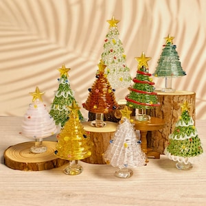 Handcrafted blown glass miniature Christmas tree ornament, a  glass figurine serving as festive home desk decor and a unique Christmas gift
