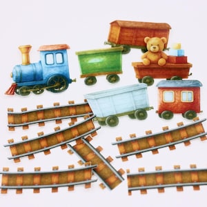 May include: A collection of toy train cars and tracks. The train includes a blue engine, several colored cars, and a teddy bear. The tracks are brown and the cars are various colors, including green, red, and light blue.
