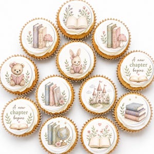 May include: A collection of eleven cupcakes with edible toppers featuring illustrations of books, a teddy bear, a rabbit, a castle, a globe, and mushrooms. Two toppers display the text A new chapter begins with an open book and floral accents.