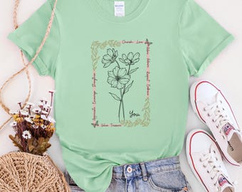 Camiseta unisex suave con flores inspiradoras y afirmaciones inspiradoras. Florece con positividad.