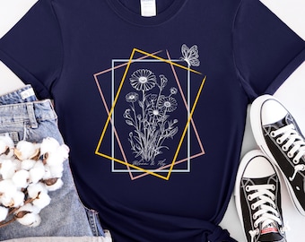 Maglietta unisex Bloom & Fly Softstyle per tutte le occasioni, maglietta con fiori e farfalle, maglietta con estetica floreale, maglietta con natura botanica e fiori di campo