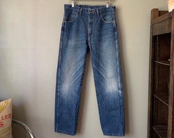 1980s Faded Indigo Rustler Jeans / vintage 80's workwear farmer distressed worn in blue denim jeans waist 33" in