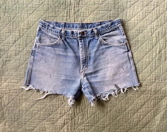 Vintage Cut Off Denim Shorts / 80’s 90’s Rustler distressed raw hem blue jean shorts waist 35”