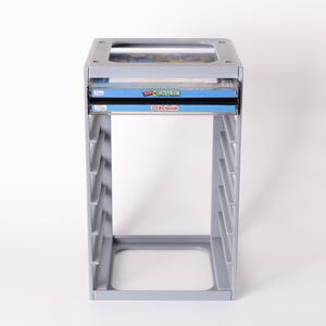 May include: A gray plastic CD storage rack with a rectangular base and open sides. Two CDs are visible, one labeled "Quick Fun" and the other "3 CDs Inside". The rack is designed to hold multiple CDs.