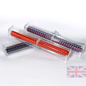 May include: Three clear plastic tubes containing colourful, twisted, decorative items. The tubes are stacked on top of each other. The items are red, purple, and black.