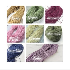 May include: A grid of eight bundles of thin, fibrous cord in various colors, labeled with text: Ecru, Green, Burgundy, Pink, Cream, Olive Green, Navy blue, and Lilac. Each bundle consists of multiple strands of string arranged in a loose, coiled formation.