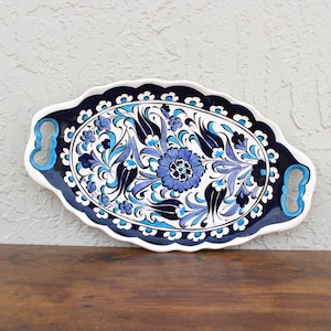 Full view of Turkish-style ceramic tray with dual handles and dark blue flower border.