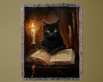 May include: A woven throw blanket featuring a black cat with yellow eyes, sitting on an open book. A lit candle and stacks of books are in the background. The blanket has a fringed edge and a dark, vintage aesthetic.