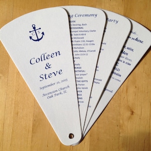 May include: White wedding program fan with blue text and an anchor design. The program includes the names Colleen & Steve, the date September 21, 2013, and the location Ascension Church, Oak Park, IL.
