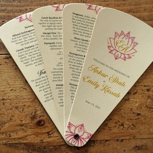 May include: A wedding program fan with a pink and gold lotus design. The fan is open to reveal the text "Welcome to the Wedding of Ankur Shah to Emily Kassah, June 19, 2021".