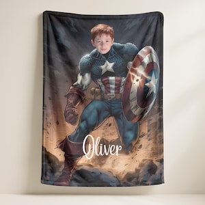 May include: A plush blanket featuring a digitally rendered image of Captain America with a child's face superimposed. The blanket showcases the superhero in his iconic costume, holding his shield. The name "Oliver" is written in a cursive font.