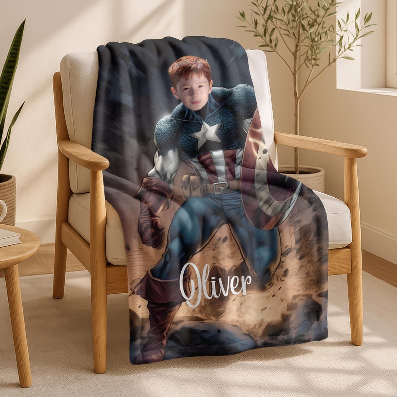 May include: A Captain America-themed blanket draped over a chair. The blanket features a digitally rendered image of a child dressed as Captain America, holding his shield. The name "Oliver" is written in a cursive font on the blanket.