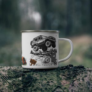 May include: White enamel camping mug with a black and white graphic of a 4x4 vehicle jumping over logs. The mug also features a dirt bike, a tent, and a sign that says "Bug Out".