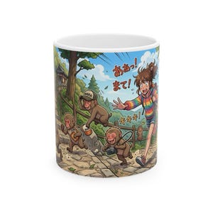 May include: A white ceramic mug featuring a colorful anime-style illustration of a person in a rainbow-striped hoodie running after monkeys on a stone path. The monkeys are holding a camera and a hat, with Japanese text reading ああっ! まて!