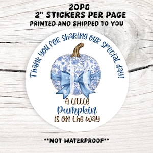 May include: Circular sticker featuring a blue floral pumpkin design and a blue bow. The text reads "Thank you for sharing our special day!" and "A little pumpkin is on the way." The sticker is 5.08 cm in diameter.