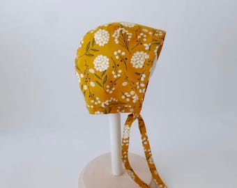Baby and toddler bonnet- mustard gold with white flowers