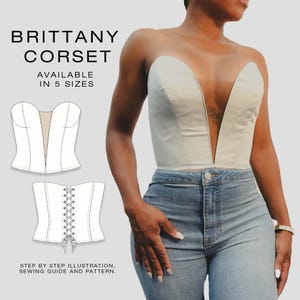 May include: A white corset with a deep V-neck design is shown on a person wearing blue jeans. The text "BRITTANY CORSET" is displayed above the corset. The text "AVAILABLE IN 5 SIZES" is also displayed. The image also shows a sewing pattern.