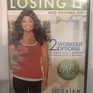 May include: DVD case for "Valerie Bertinelli: Losing It and Keeping Fit!" with a woman in workout clothes. The cover includes text for "2 Workout Options!" and "Valerie's Bikini Ready Workout" with the Jenny Craig and Gaiam logos.