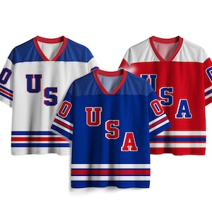 May include: Three short-sleeved jerseys in red, white, and blue. Each jersey has a V-neck collar and the word "USA" in large letters on the front. The sleeves have stripes and the number "0".