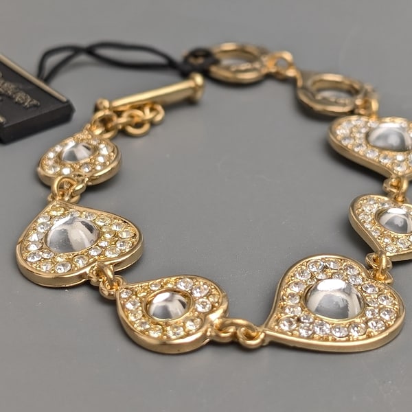 Exclusiva pulsera Yves Saint Laurent de oro con diamantes de imitación en forma de corazón, accesorio vintage para mujer.
