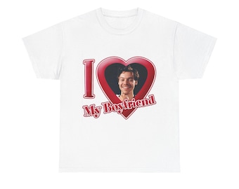 May include: White t-shirt featuring a red heart with a photo of a smiling person. The text "I My Boyfriend" is printed in red, with the word "I" in a bold, capital letter.