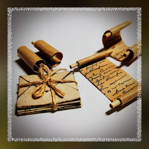 May include: A stack of vintage envelopes tied with twine, next to two rolled up pieces of parchment paper with handwritten text.