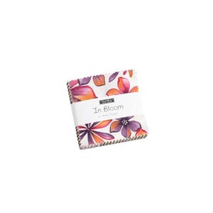 May include: A bundle of fabric squares featuring a floral design in pink, orange, and purple hues. The fabric is wrapped with a white band that reads "In Bloom" by Holly Taylor.