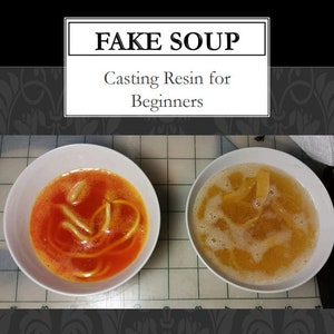 May include: Two white bowls filled with a clear yellow liquid and orange liquid, both with yellow noodles. The text "FAKE SOUP" is written in black on a white rectangle above the bowls. The text "Casting Resin for Beginners" is written in black below the bowls.