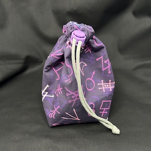 Molly’s Coat | Drawstring Dice Bag. Lavender Astrology/Alchemy Symbols, Blue Crescent Moons. DND, Mighty Nein. Dice/Tarot/Rune Storage.