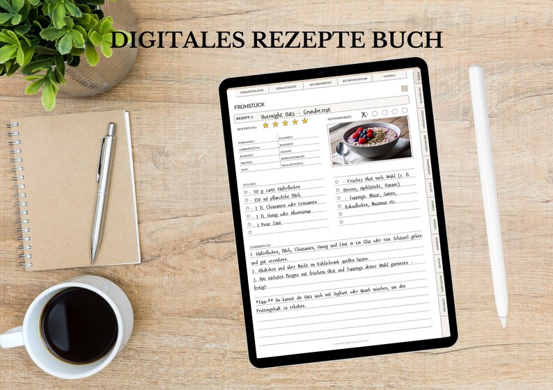 May include: A digital recipe book displayed on a tablet, showing a breakfast recipe with a photo of oatmeal and berries. The tablet is on a wooden surface, with a notepad, pen, coffee cup, and a plant in a silver pot. The text "DIGITALES REZEPTE BUCH" is at the top.