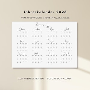 Può includere: Un calendario 2026 in bianco e nero con il titolo "Jahreskalender 2026" in alto. Il calendario mostra i mesi in formato griglia. Il testo in basso recita "ZUM AUSDRUCKEN PDF | SOFORT DOWNLOAD".