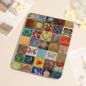 May include: A decorative tablet case featuring a mosaic design of colorful, square tiles. Each tile displays a unique pattern, including flowers, suns, and geometric shapes. The case is made of a clear, protective material.