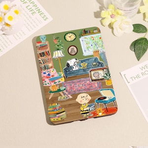 May include: A decorative sticker featuring a cartoon living room scene with Snoopy and Woodstock on a blue couch. The sticker includes a bookshelf, a clock, a TV, and a record player. The text "LL ME WHY" is visible on a stack of books.