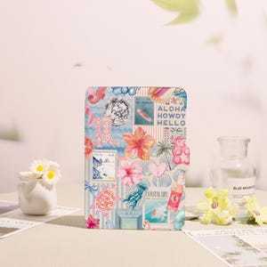 May include: A square, colourful collage featuring a variety of tropical and coastal themed illustrations. The design includes images of a disco ball, cowboy boots, hibiscus flowers, a turtle, and the words "Aloha Howdy Hello".