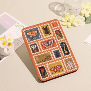 May include: An orange rectangular case with a series of postage stamp designs depicting insects and floral motifs. The stamps display values such as 40p, 60p, and 20p. The case has a textured finish and a decorative border.