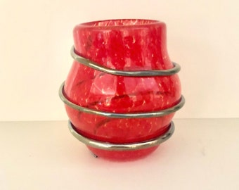 Hand blown red glass vase with a silver wrap