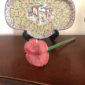 Hand sculpted pink powder glass flower with a green straight stem