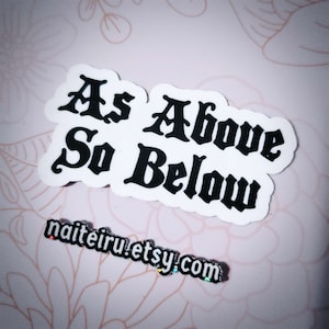 May include: White sticker with black text that reads "As Above So Below".