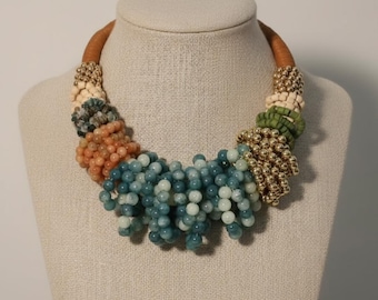 Bold colorful beaded necklace with gold tone details artistic boho statement jewelry for women chunky vintage inspired necklace